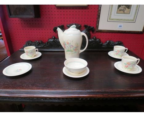 A Susie Cooper part coffee set, coffee pot, sugar bowl, three cups and five saucers