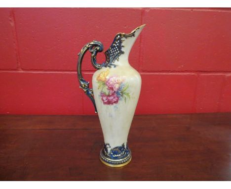 A Royal Worcester porcelain ewer, the pierced top with scrolled foliate handle, floral sprays, beaded base