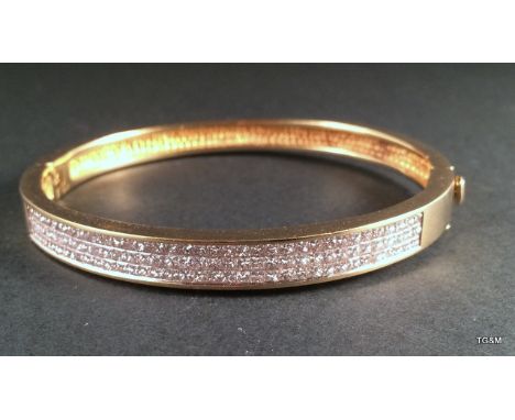 An 18ct yellow gold diamond bangle set with 90 diamonds approc2.5cts
