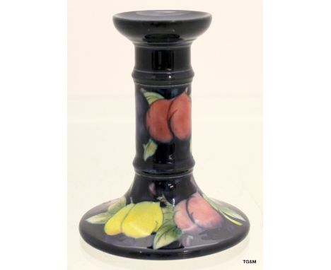 A Moorcroft Plum and Wisteria candlestick 13cm high x 5cm neck x 9cm base