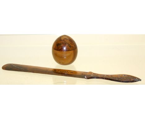 A Treen inkwell in the form of an egg olive wood with letter opener
