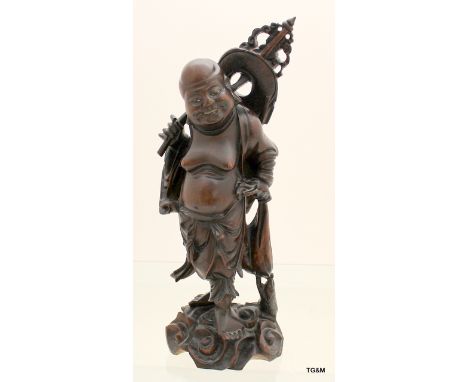 Well carved Chinese fat Buddha figure on scroll base with bone teeth, 39cm high