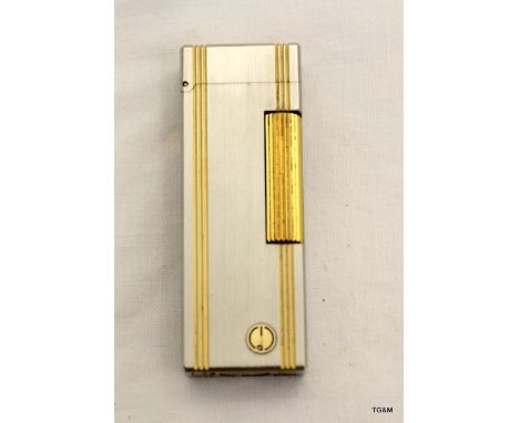 Dunhill gas cigarette lighter with line decoration, 6.4cm high
