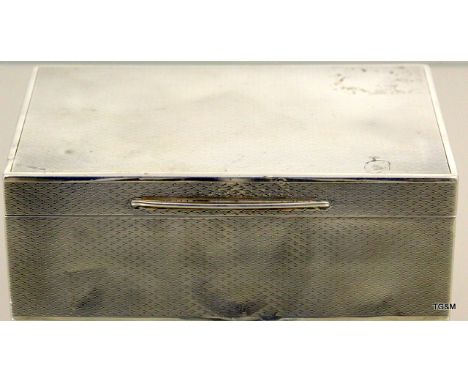 Silver cigarette box with engine-turned decoration, hallmarked London 1916. Measuring 14cm x 9cm x 5cm