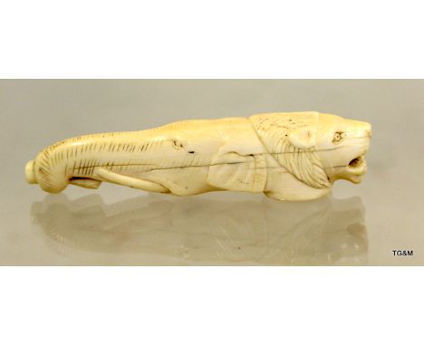 C19th carved Indian ivory walking stick handle in form of lion and elephant head 11cm