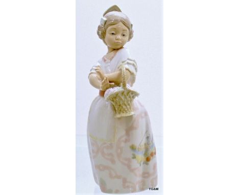 A Nao figure of a girl with basket. 26cm