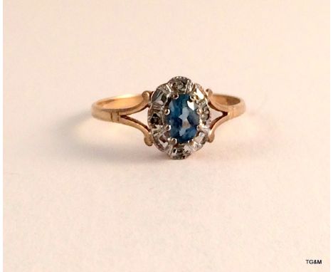 A 9ct gold diamond and aquamarine ladies ring size r