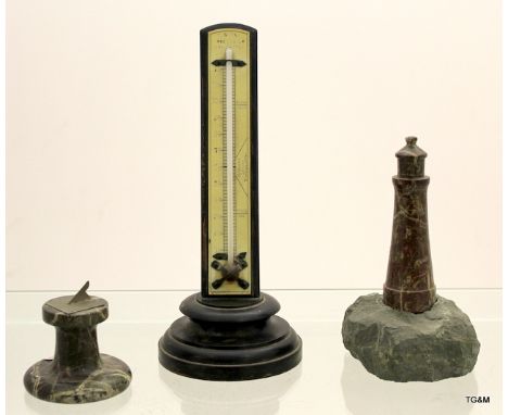 A Retro thermometer on stand sundial and a granite light house