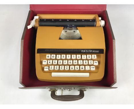 A Petite International De-Luxe child's typewriter