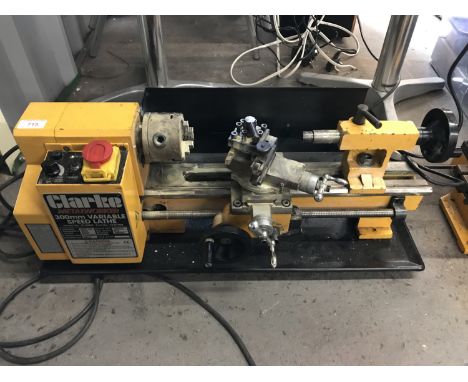 A Clarke Metalworker drill CMD10 together with a Clarke Metalworker 300mm variable speed lathe CL 300 M and a quantity of acc