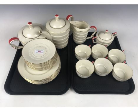 A Rosenthal Ivory Art Deco porcelain tea service for six, of tapering cylindrical and stacked form, with concertina loop hand