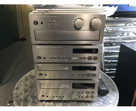 A Yamaha hi-fi unit including a CDX-10 compact disc player, a TX-10 am/fm stereo tuner, an AX-10 stereo integrated amplifier,