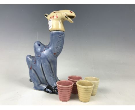 A kitsch ceramic novelty liqueur decanter and glass set modelled as a Bactrian camel, circa 1930s-1950s