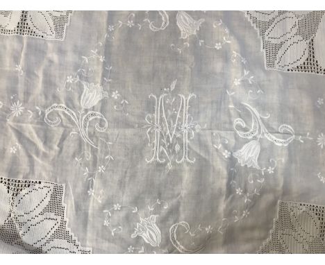 A late Victorian / Edwardian whitework and crocheted linen coverlet / cloth, having a central embroidered letter 'M', surroun