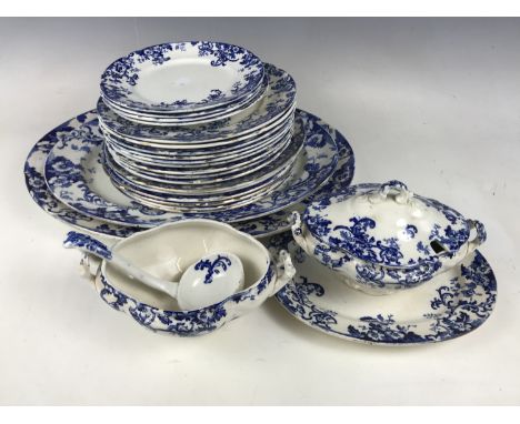 A quantity of late 19th century flow blue dinner ware including a soup tureen with ladle, ashets and plates etc