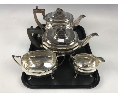 A Walker and Hall electroplate Georgian-shape three-piece tea service together with one other teapot