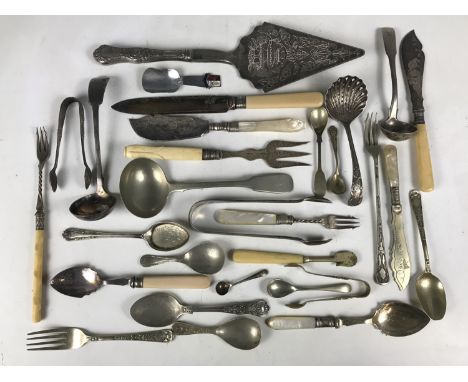 A quantity of electroplate cutlery including ladles, caddy spoons and sugar tongs etc