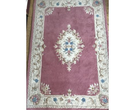 An Akbar rose and ivory rug, 120 x 180 cm