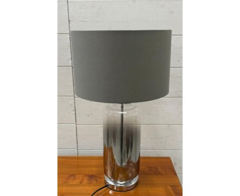 A smoked glass and chrome table lamp 