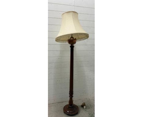 A mahogany floor lamp with copper oil lamp style top on fluted and turned central column. Height 