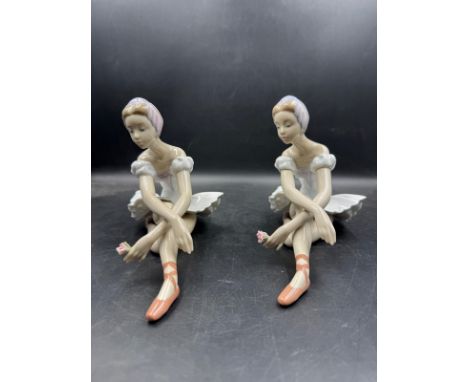 Two Lladro figures of seated ballerinas