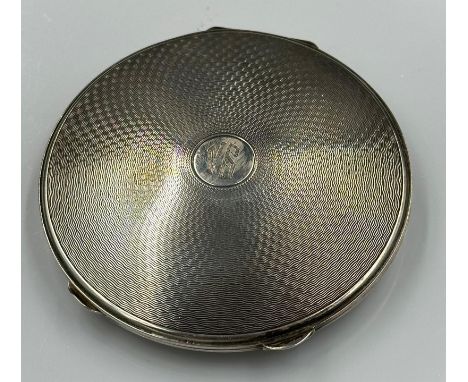 A silver compact by David Sutton & Sons, hallmarked for Birmingham 1948