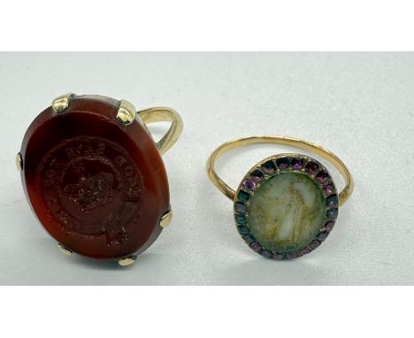 An English 18th century gold and ruby morning ring and a 19th century gold and carnelian ring