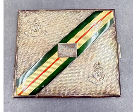 An engraved silver cigarette case celebrating the 40th Pathans regiment by Goldsmiths & Silversmiths Co Ltd with enamel decor