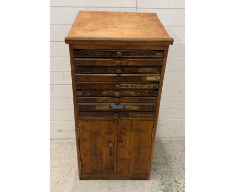 A vintage printers cabinet comprising of eight drawers with cupboard under (H122cm W55cm D45cm)