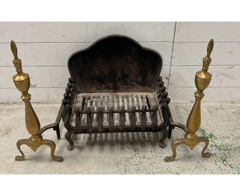 A cast fire grate and a pair of brass fire dogs (H41cm W45cm)