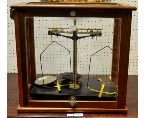A cased set of scientific balance scales