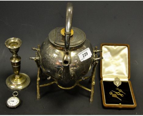 A continental silver pocket watch ; a silver plated spirit kettle ; a weighted silver candlestick (3)