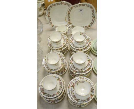 An Aynsley April Rose pattern twelve-setting tea service, comprising tea cups, saucers and tea plates, bread plate, milk jug 