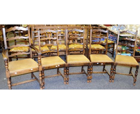 A set of four early 20th Century oak dining chairs shaped ladder back splats, H frame stretcher, a conforming carver (5)