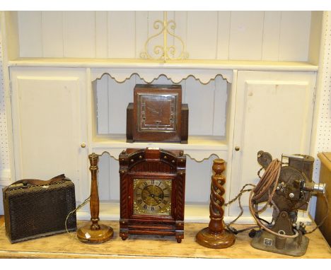 A 19th Century stained mahogany mantel clock, brass dial with Roman numerals, twin winding holes striking on a gong c.1890; a
