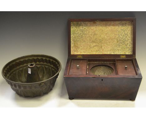 A post-Regency mahogany sarcophagus tea caddy (faults); a Victorian copper mould (2)