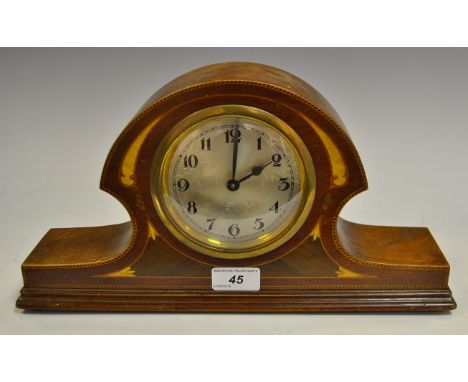 An Edwardian shaped mahogany mantel clock, inlaid with marquetry and barber pole stringing, c.1910 