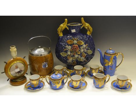 An Oriental eggshell part coffee service, blue ground, decorated with a Dragon picked out in gilt;  a continental majolica mo