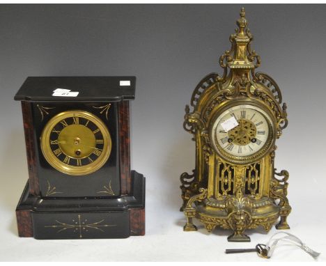 A Victorian slate mantel clock; an early 20th century brass mantel clock (2)