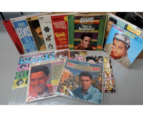 A collection of Elvis LP Records including 40 greatest (pink discs), Loving You, Fun in Acapulco, Something for Everybody, Bl