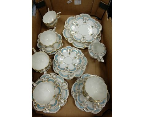 A Wileman Foley China 19th century tea set decorated with enamel and gilded colours. 10 cups, 2 sandwich plates, 12 saucers, 