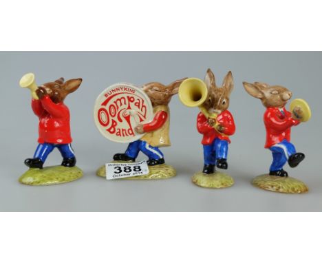 Royal Doulton Bunnykins Oompah Band comprising Drummer DB26 (nip to ear), Cymbals DB25, Sousaphone DB23 and Trumpeter DB24, w