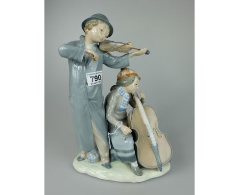 Nao figure of Huge grouping of a boy and girl dressed in winter clothes playing the violin and cello height 33cm (small chip 