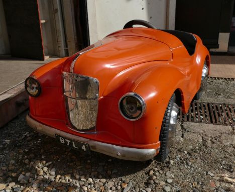 A 1940's / 1950's ' Austin Junior Forty ' ( J40 ) child's pedal car, ex fairground ride, repainted orange, dummy engine and p