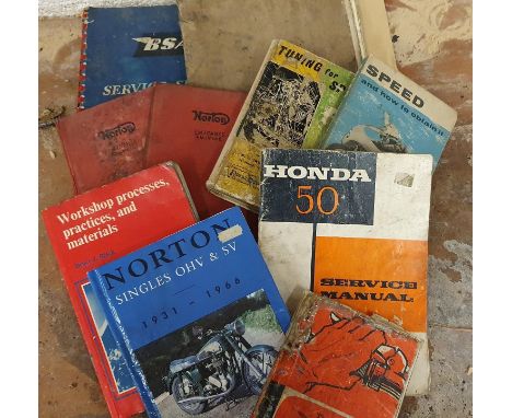 A Honda 50 service manual, together with various BSA and Norton manuals.