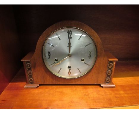 A 1950's walnut cased Smith's striking and chiming mantel clock with floating balance 