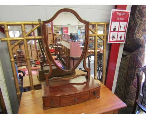 A Victorian flame mahogany shield back table-top mirror on three drawer base, 80cm tall x 54cm wide approx.  