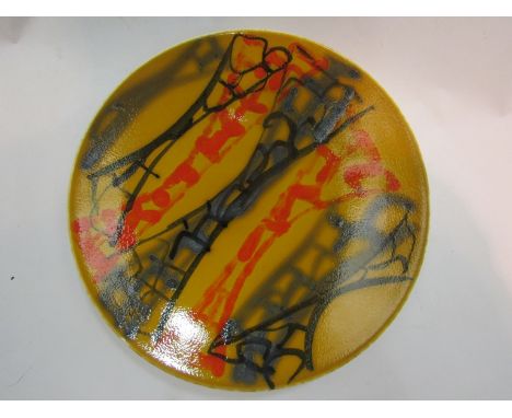 A Poole dish in yellow, orange and grey tones, 27cm diameter