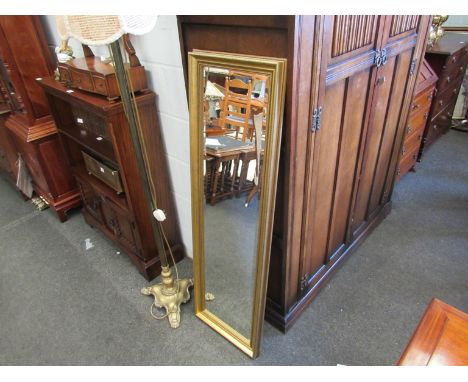 A slim gilt wall mirror, 127cm x 40cm