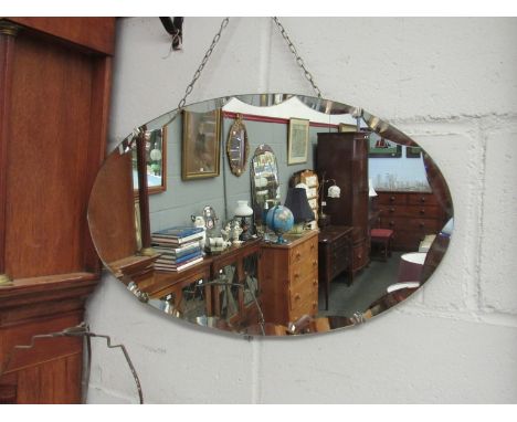 An Art Deco oval wall mirror, 60cm wide